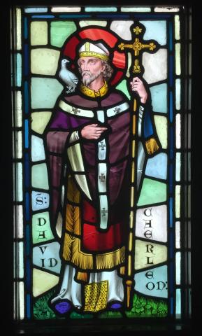 Stained glass image of Saint David with a dove on his shoulder